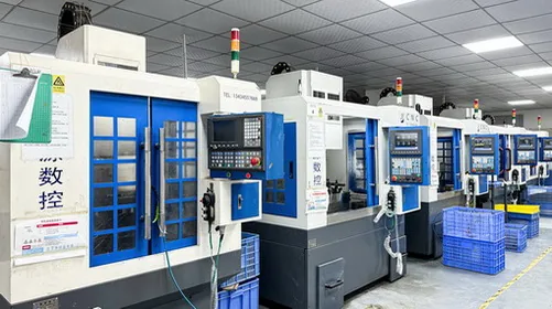CNC machining cells arranged along a production line